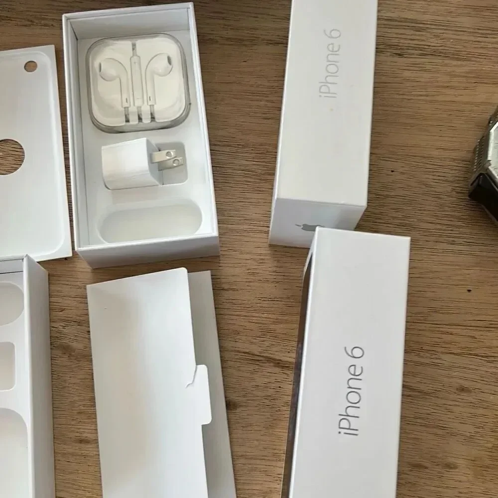 2 Apple iPhone 6 boxes with some accessories
